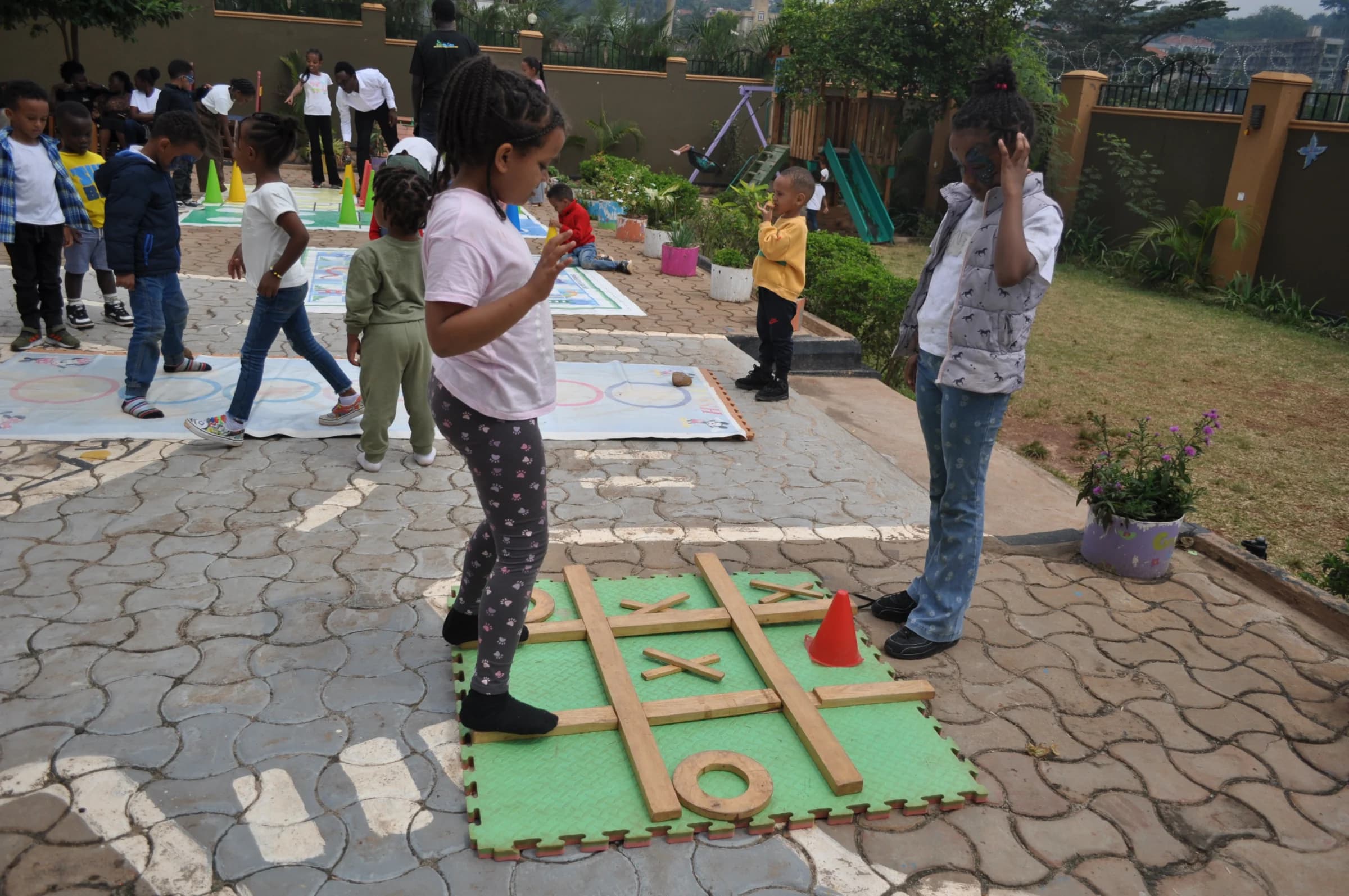 Eco-Bloom children playing large outdoor games together