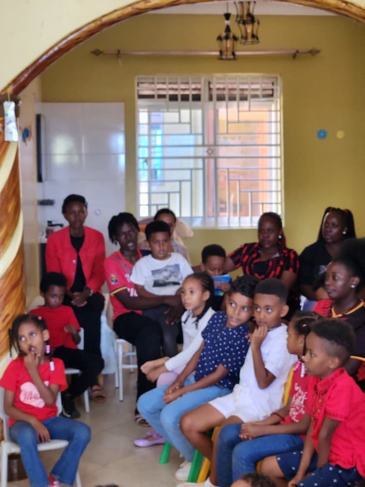 Children and adults watching the Independence Day programme