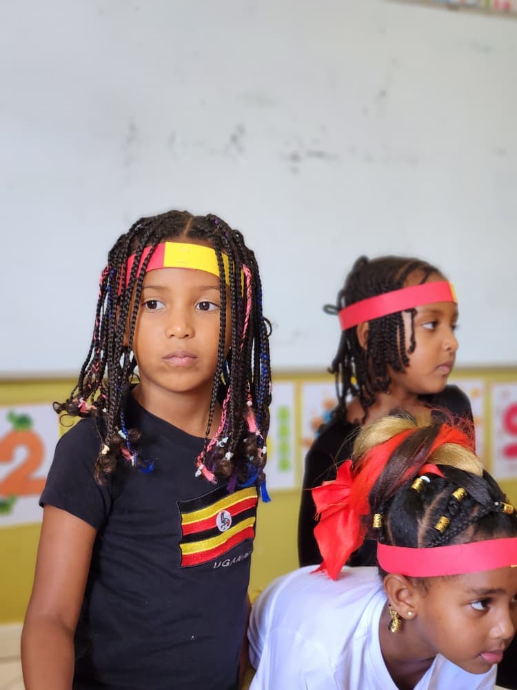 Eco-Bloom pupils dressed in the colours of the Ugandan flag