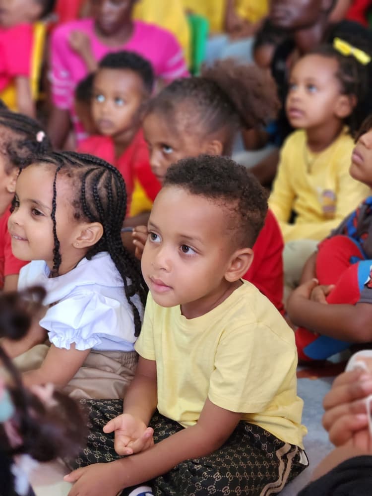 Young pupils watching the Independence Day presentation