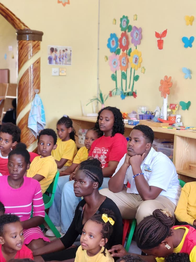 Eco-Bloom staff and pupils watching the programme
