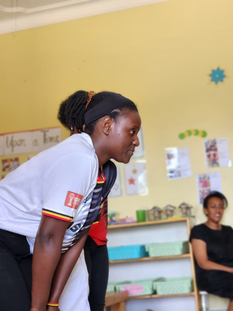 A member of staff taking part in the Uganda celebration